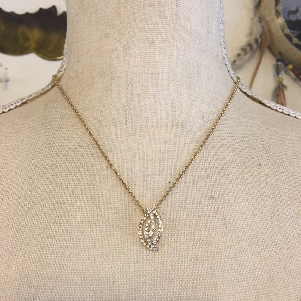 Clear rhinestone covered pendant on rolo chain